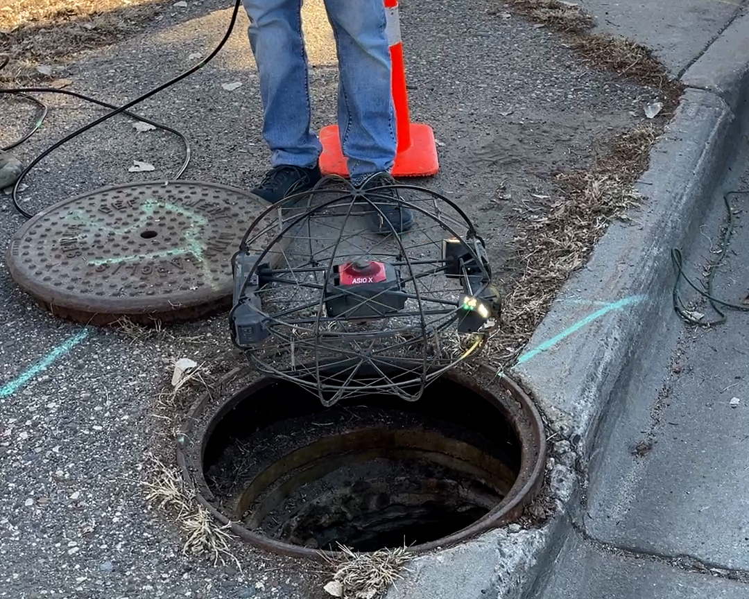 Drone entering manhole
