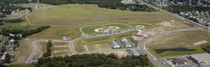 Redeveloped brownfield with commercial development and baseball fields