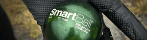 A gloved hand holding a green sphere labeled ‘SmartBall.’