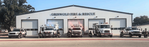 Banner image of firefighters and emergency vehicles lined up in front of Griswold Fire & Rescue station.
