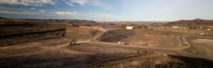 Large solid waste yard with earth moving machinery