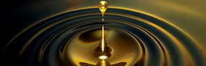 Drop of oil causes ripple wave effect