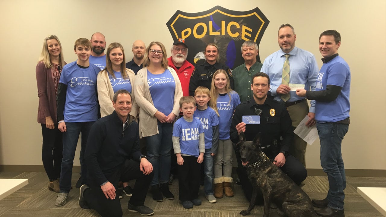  Trevor Frank, Police Chief Jamie Graff, Officer Lucas Meyer with Rocko and members of the K-9 fundraising committee