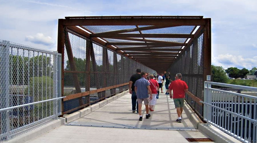 pedestrians crossing bridge